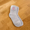 Grey fluffy socks with Point Your Toes embroidery