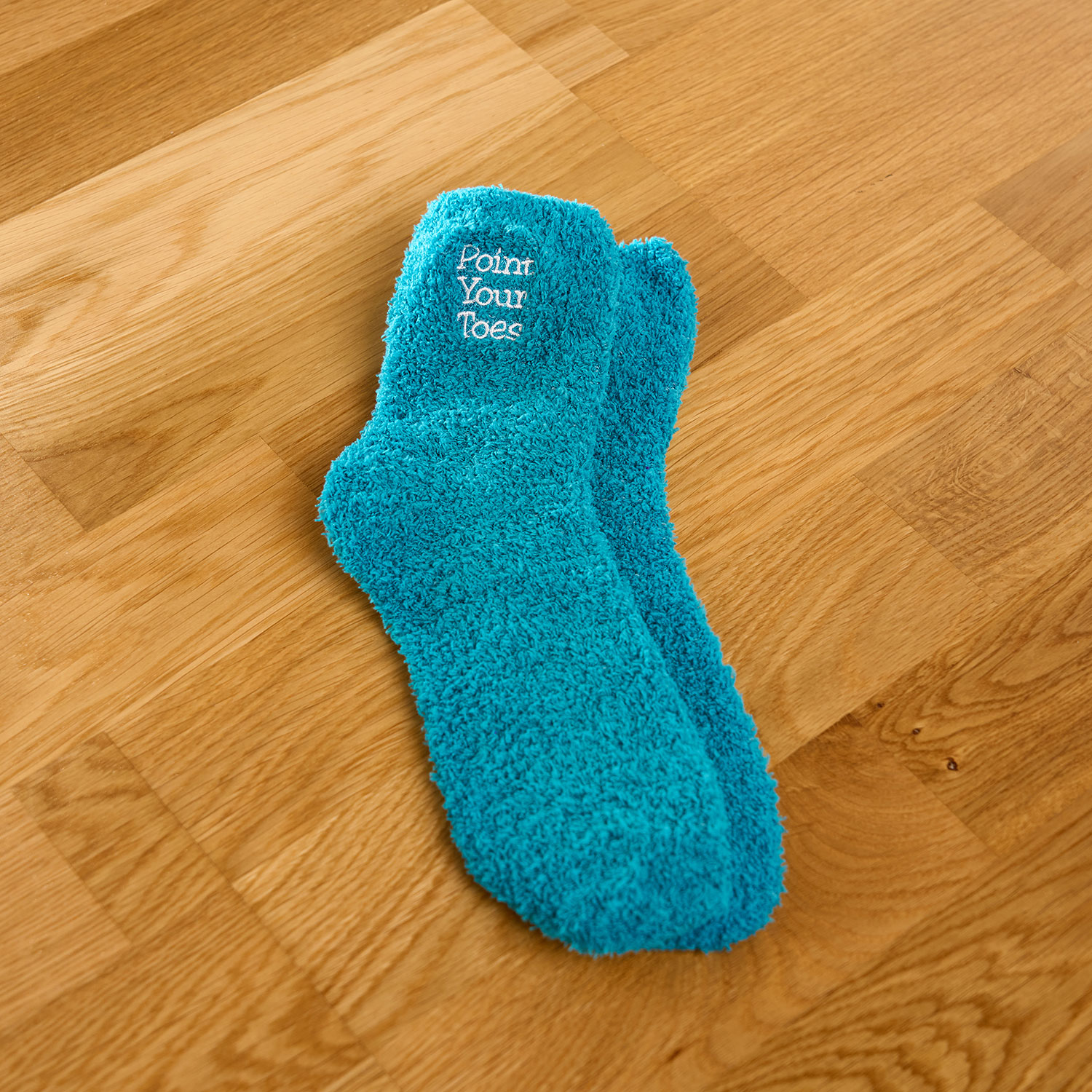 AH2024-SF-TUR-PYT_01 Turquoise fluffy socks with Point Your Toes embroidery